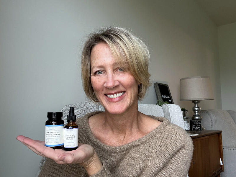 Jaime holding Forefront Health supplements
