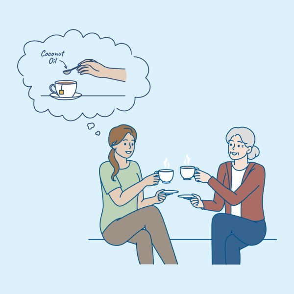 Woman putting coconut oil in her tea